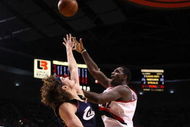 PORTLAND, OR - JANUARY 21:  Greg Oden #52 of the Portland Trail Blazers lays up the ball against Anderson Varejao #17 of the Cleveland Cavaliers at the Rose Garden on January 21, 2009 in Portland, Oregon.  NOTE TO USER: User expressly acknowledges and agrees that, by downloading and or using this Photograph, user is consenting to the terms and conditions of the Getty Images License Agreement.  (Photo by Jonathan Ferrey/Getty Images)