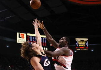 PORTLAND, OR - JANUARY 21:  Greg Oden #52 of the Portland Trail Blazers lays up the ball against Anderson Varejao #17 of the Cleveland Cavaliers at the Rose Garden on January 21, 2009 in Portland, Oregon.  NOTE TO USER: User expressly acknowledges and agrees that, by downloading and or using this Photograph, user is consenting to the terms and conditions of the Getty Images License Agreement.  (Photo by Jonathan Ferrey/Getty Images)