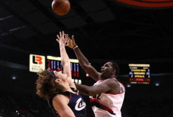 PORTLAND, OR - JANUARY 21:  Greg Oden #52 of the Portland Trail Blazers lays up the ball against Anderson Varejao #17 of the Cleveland Cavaliers at the Rose Garden on January 21, 2009 in Portland, Oregon.  NOTE TO USER: User expressly acknowledges and agrees that, by downloading and or using this Photograph, user is consenting to the terms and conditions of the Getty Images License Agreement.  (Photo by Jonathan Ferrey/Getty Images)