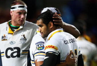HAMILTON, NEW ZEALAND - MAY 15: Ben Hand (L) and Afusipa Taumoepeau of the Brumbies reflect after their loss in the round 14 Super 14 match between the Chiefs and the Brumbies at Waikato Stadium on May 15, 2009 in Hamilton, New Zealand.  (Photo by Sandra Mu/Getty Images)