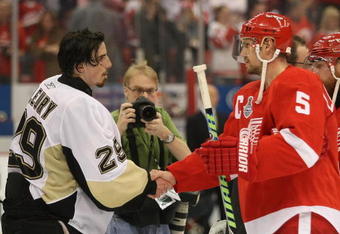 DETROIT - JUNE 12: Marc-Andre Fleury #29 of the Pittsburgh Penguins and Nicklas Lidstrom #5 of the Detroit Red Wings shake hands following Game Seven of the 2009 NHL Stanley Cup Finals at Joe Louis Arena on June 12, 2009 in Detroit, Michigan. (Photo by Bruce Bennett/Getty Images)