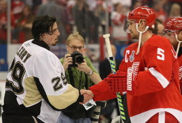 DETROIT - JUNE 12: Marc-Andre Fleury #29 of the Pittsburgh Penguins and Nicklas Lidstrom #5 of the Detroit Red Wings shake hands following Game Seven of the 2009 NHL Stanley Cup Finals at Joe Louis Arena on June 12, 2009 in Detroit, Michigan. (Photo by Bruce Bennett/Getty Images)