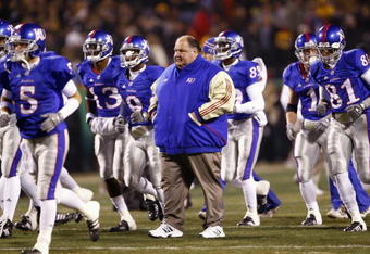 KANSAS CITY, MO - NOVEMBER 24: Coach Mark Mangino of the Kansas Jayhawks walks on the field with his team before the game against the Missouri Tigers at Arrowhead Stadium on November 24, 2007 in Kansas City, Missouri. (Photo by Jamie Squire/Getty Images) 