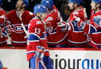 MONTREAL- MARCH 10:  Andrei Kostitsyn #46 and Alex Tanguay #13 of the Montreal Canadiens celebrate the third period goal by Saku Koivu #11 with teammates during the game against the Edmonton Oilers at the Bell Centre on March 10, 2009 in Montreal, Quebec, Canada.  The Canadiens defeated the Oilers 4-3 in overtime.  (Photo by Richard Wolowicz/Getty Images)