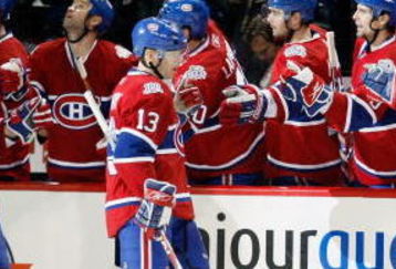 MONTREAL- MARCH 10:  Andrei Kostitsyn #46 and Alex Tanguay #13 of the Montreal Canadiens celebrate the third period goal by Saku Koivu #11 with teammates during the game against the Edmonton Oilers at the Bell Centre on March 10, 2009 in Montreal, Quebec, Canada.  The Canadiens defeated the Oilers 4-3 in overtime.  (Photo by Richard Wolowicz/Getty Images)