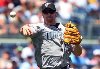 NEW YORK - JULY 06:  Scott Rolen #33 of the Toronto Blue Jays throws to first base for an out against the New York Yankees on July 6, 2009 at Yankee Stadium in the Bronx borough of New York City.  (Photo by Jim McIsaac/Getty Images)