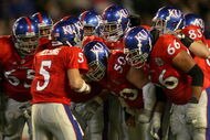 MIAMI - JANUARY 03:  Quarterback Todd Reesing #5 of the Kansas Jayhawks huddles with his team in the first quarter against the Virginia Tech Hokies during the FedEx Orange Bowl at Dolphin Stadium on January 3, 2008 in Miami, Florida.  (Photo by Marc Serota/Getty Images)