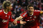 LIVERPOOL, ENGLAND - APRIL 08:  Fernando Torres of Liverpool celebrates scoring the opening goal with team mate Steven Gerrard (R) during the UEFA Champions League Quarter Final First Leg match between Liverpool and Chelsea at Anfield on April 8, 2009 in Liverpool, England.  (Photo by Clive Rose/Getty Images)