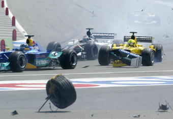 HOCKENHEIM, GERMANY - AUGUST 3:  Ralph Firman of Great Britain and Jordan collides with the remains of Kimi Raikkonen's accident during the Formula One German Grand Prix at Hockenheim on August 3, 2003 in Hockenheim, Germany. (Photo by Mark Thompson/Getty Images)