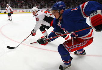 NEW YORK - APRIL 22:  Nikolai Zherdev #13 of the New York Rangers skates against David Steckel #39 of the Washington Capitals during Game Four of the Eastern Conference Quarterfinal Round of the 2009 NHL Stanley Cup Playoffs on April 22, 2008 at Madison Square Garden in New York City.  (Photo by Jim McIsaac/Getty Images)