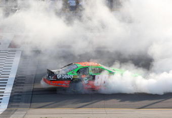 NEWTON, IA - AUGUST 1: Brad Keselowski, driver of the #88 GoDaddy.com Chevrolet, does a burnout following his win in the NASCAR Nationwide Series U.S. Cellular 250 at Iowa Speedway on August 1, 2009 in Newton, Iowa.  (Photo by Jonathan Daniel/Getty Images)