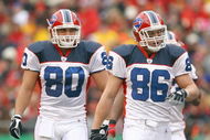 KANSAS CITY, MO - NOVEMBER 23: Derek Schouman #80 and Derek Fine #86 of the Buffalo Bills walk on the field during the game against the Kansas City Chiefs on November 23, 2008 at Arrowhead Stadium in Kansas City, Missouri. (Photo by Jamie Squire/Getty Images)