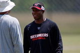TAMPA, FL - MAY 01:  Head coach Raheem Morris of the Tampa Bay Buccaneers talks with a coach during the Buccaneers Rookie Minicamp at One Buccaneer Place on May 1, 2009 in Tampa, Florida.  (Photo by J. Meric/Getty Images)