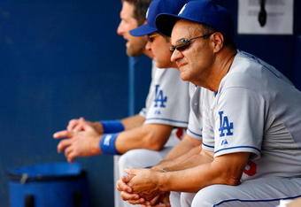 ATLANTA - AUGUST 01:  Manager Joe Torre #6 of the Los Angeles Dodgers looks on from the dugout against the Atlanta Braves on August 1, 2009 at Turner Field in Atlanta, Georgia.  (Photo by Kevin C. Cox/Getty Images)