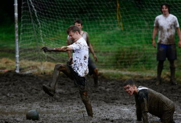 DUNOON, UNITED KINGDOM - JUNE 16:  Players take part in the annual UK Swamp Soccer tournament on June 16, 2007 in Dunoon, Scotland .Swamp Soccer originates from the swamps of Finland and is fast becoming an alternative sport with tournaments taking place all over the World. (Photo by Jeff J Mitchell/Getty Images)