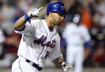 NEW YORK - AUGUST 01:  Angel Pagan #16 of the New York Mets celebrates after hitting a eighth inning grand slam against the Arizona Diamondbacks on August 1, 2009 at Citi Field in the Flushing neighborhood of the Queens borough of New York City.  (Photo by Jim McIsaac/Getty Images)
