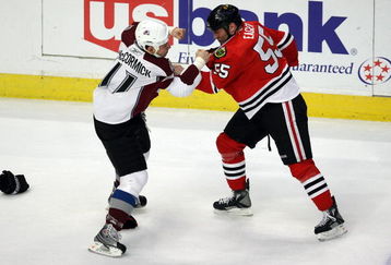CHICAGO - MARCH 08:  Ben Eager #55 of the Chicago Blackhawks fights with Cody McCormick #11 of the Colorado Avalanche during the first period at the United Center on March 8, 2009 in Chicago, Illinois.  (Photo by Jonathan Daniel/Getty Images)