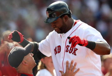 BOSTON - JULY 30:  Designated hitter David Ortiz #34 of the Boston Red Sox celebrates with manager Terry Francona #47 after hitting a three-run home run against the Oakland A's in the seventh inning to give the Red Sox a 6-5 lead on July 30, 2009 at Fenway Park in Boston, Massachusetts.  (Photo by Elsa/Getty Images)