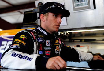 JOLIET, IL - JULY 10:  Jamie McMurray, driver of the #26 Sears Auto Center/Valvoline Ford, stands in the garage during practice for the NASCAR Sprint Cup Series LifeLock.com 400 at Chicagoland Speedway on July 10, 2009 in Joliet, Illinois.  (Photo by Rusty Jarrett/Getty Images for NASCAR)
