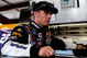 JOLIET, IL - JULY 10: Jamie McMurray, driver of the #26 Sears Auto Center/Valvoline Ford, stands in the garage during practice for the NASCAR Sprint Cup Series LifeLock.com 400 at Chicagoland Speedway on July 10, 2009 in Joliet, Illinois. (Photo by Rusty Jarrett/Getty Images for NASCAR)