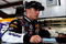 JOLIET, IL - JULY 10:  Jamie McMurray, driver of the #26 Sears Auto Center/Valvoline Ford, stands in the garage during practice for the NASCAR Sprint Cup Series LifeLock.com 400 at Chicagoland Speedway on July 10, 2009 in Joliet, Illinois.  (Photo by Rusty Jarrett/Getty Images for NASCAR)