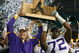 ATLANTA - DECEMBER 01:  Head coach Les Miles and Glenn Dorsey #72  of the Louisiana State University Tigers celebrate with the SEC trophy after defeating the University of Tennessee Volunteers 21-14 in the SEC Championship game on December 1, 2007 at the Georgia Dome in Atlanta, Georgia.  (Photo by Chris Graythen/Getty Images)