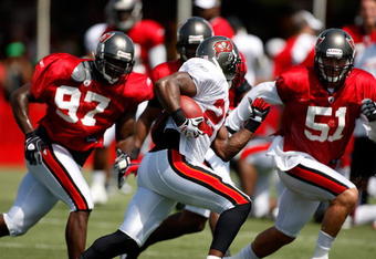 TAMPA - AUGUST 01:  Running back Carnell Williams #24 of the Tampa Bay Buccaneers runs the ball during Training Camp at One Buccaneer Place on August 1, 2009 in Tampa, Florida.  (Photo by J. Meric/Getty Images)