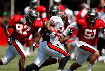 TAMPA - AUGUST 01:  Running back Carnell Williams #24 of the Tampa Bay Buccaneers runs the ball during Training Camp at One Buccaneer Place on August 1, 2009 in Tampa, Florida.  (Photo by J. Meric/Getty Images)