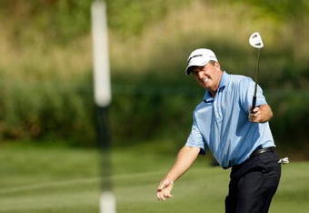 CARMEL, IN - AUGUST 02:  Fred Funk of the USA hits his third shot on the 13th hole during the 2009 U.S. Senior Open on August 2, 2009 at Crooked Stick Golf Club in Carmel, Indiana.  (Photo by Jamie Squire/Getty Images)