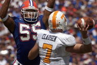 GAINSVILLE, FL - SEPTEMBER 20: Linebacker Channing Crowder #55 of the University of Florida Gators deflects a pass by quarterback Casey Clausen #7 of the University of Tennessee Volunteers during the game at Ben Hill Griffin Stadium on September 20, 2003 in Gainesville, Florida. Tennessee defeated Florida 24-10. (Photo by Matt Stroshane/Getty Images)