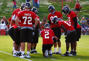 FLOWERY BRANCH, GA - AUGUST 01:  Quarterback Matt Ryan #2 of the Atlanta Falcons runs the offense during opening day of training camp on August 1, 2009 at the Falcons Training Complex in Flowery Branch, Georgia.  (Photo by Kevin C. Cox/Getty Images)