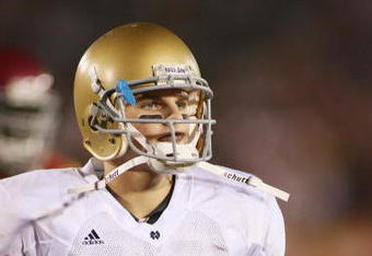 LOS ANGELES - NOVEMBER 29:  Jimmy Clausen #7 of the Notre Dame Fighting Irish walks on the field against the USC Trojans on November 29, 2008 at the Los Angeles Memorial Coliseum in Los Angeles, California.  USC won 38-3.  (Photo by Jeff Golden/Getty Images)