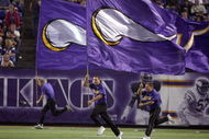 MINNEAPOLIS - AUGUST 25: Flag runners of the Minnesota Vikings run up field against the Baltimore Ravens on August 25, 2006 at the H.H.H. Metrodome in Minneapolis, Minnesota. (Photo by David Sherman/Getty Images)