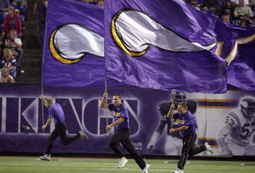 MINNEAPOLIS - AUGUST 25:  Flag runners of the Minnesota Vikings run up field against the Baltimore Ravens on August 25, 2006 at the H.H.H. Metrodome in Minneapolis, Minnesota. (Photo by David Sherman/Getty Images)