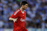 BARCELONA, SPAIN - AUGUST 02: Xabi Alonso of Liverpool controls the ball during the pre-season friendly match between Espanyol and Liverpool at the Nuevo Estadio de Cornella-El Prat on August 2, 2009 in Barcelona, Spain. Espanyol won the match 3-0. (Photo by Jasper Juinen/Getty Images)