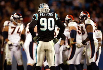 CHARLOTTE, NC - DECEMBER 14:  Julius Peppers #90 of the Carolina Panthers waits for the Denver Broncos offense during their game at Bank of America Stadium on December 14, 2008 in Charlotte, North Carolina  (Photo by Streeter Lecka/Getty Images)