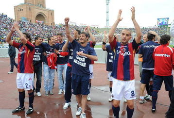 BOLOGNA, ITALY - MAY 31:  Nicola Mingazzini #8, Davide Marchini #2 and Bologna FC players celebrate for remaining in A category after winning 3:1 their Serie A match against Calcio Catania at the Stadio Renato Dall'Ara on May 31, 2009 in Bologna, Italy.  (Photo by New Press/Getty Images)