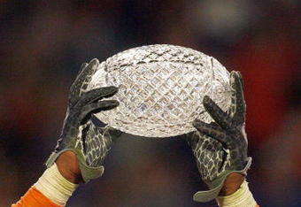 MIAMI - JANUARY 08:  Brandon Spikes #51 of the Florida Gators holds up the winning trophy after the FedEx BCS National Championship Game against the Oklahoma Sooners at Dolphin Stadium on January 8, 2009 in Miami, Florida.  (Photo by Eliot J. Schechter/Getty Images)