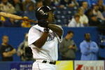 TORONTO - OCTOBER 1:  Infielder Carlos Delgado #25 of the Toronto Blue Jays swings at a New York Yankees pitch during the game at the Skydome on October 1, 2004 in Toronto, Ontario. The Blue Jays defeated the Yankees 7-0. (Photo By Dave Sandford/Getty Images)