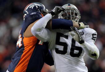 DENVER - NOVEMBER 23:  Derrick Burgess #56 of the Oakland Raiders rushes against the block of Ryan Harris #74 of the Denver Broncos during week 12 NFL action at Invesco Field at Mile High on November 23, 2008 in Denver, Colorado. Fargas rushed for 107 yards as the Raiders defeated the Broncos 31-10.  (Photo by Doug Pensinger/Getty Images)