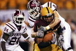 TEMPE, AZ - SEPTEMBER 1:  Terry Richardson #17 of the Arizona State Sun Devils is brought down by Garrett Schultz #9 of the Temple Owls at Sun Devil Stadium on September 1, 2005 in Tempe, Arizona. Arizona State defeated Temple 63-16.  (Photo by Jeff Gross/Getty Images)