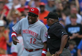 CHICAGO - JULY 26: Manager Dusty Baker #12 of the Cincinnati Reds argues with home plate umpire Laz Diaz #63 after a play at the plate in the 8th inning on July 26, 2009 at Wrigley Field in Chicago, Illinois. The Cubs defeated the Reds 5-2. (Photo by Jonathan Daniel/Getty Images)