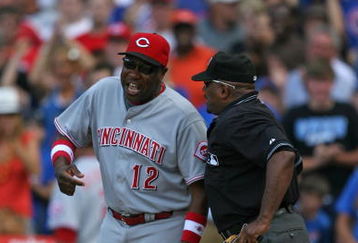 CHICAGO - JULY 26: Manager Dusty Baker #12 of the Cincinnati Reds argues with home plate umpire Laz Diaz #63 after a play at the plate in the 8th inning on July 26, 2009 at Wrigley Field in Chicago, Illinois. The Cubs defeated the Reds 5-2. (Photo by Jonathan Daniel/Getty Images)