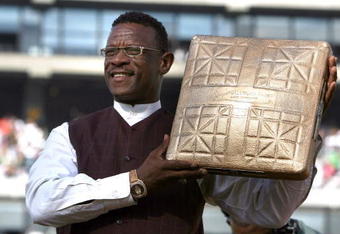 OAKLAND, CA - AUGUST 01:  Hall of Fame baseball player Rickey Henderson holds up a golden base during a ceremony to retire his number 24 by the Oakland Athletics before the start of the game against the Toronto Blue Jays August 1, 2009 at the McAfee Coliseum in Oakland, California. Henderson was inducted into the Baseball Hall of Fame July 26.  (Photo by Justin Sullivan/Getty Images)