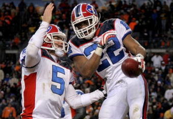 DENVER - DECEMBER 21:  Running back Fred Jackson #22 of the Buffalo Bills celebrates his game winning eight yard touchdown run with quarterback Trent Edwards #5 in the fourth quarter against the Denver Broncos at Invesco Field at Mile High on December 21, 2008 in Denver, Colorado. The Bills defeated the Broncos 30-23.  (Photo by Doug Pensinger/Getty Images)
