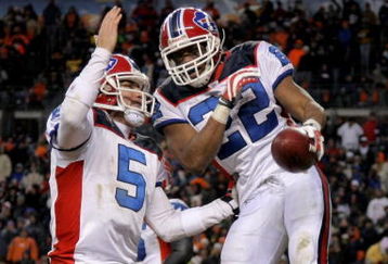 DENVER - DECEMBER 21:  Running back Fred Jackson #22 of the Buffalo Bills celebrates his game winning eight yard touchdown run with quarterback Trent Edwards #5 in the fourth quarter against the Denver Broncos at Invesco Field at Mile High on December 21, 2008 in Denver, Colorado. The Bills defeated the Broncos 30-23.  (Photo by Doug Pensinger/Getty Images)