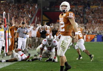 GLENDALE, AZ - JANUARY 05:  Quarterback Colt McCoy #12 of the Texas Longhorns scores on a 14 yard touchdown rush against the Ohio State Buckeyes during the third quarter of the Tostitos Fiesta Bowl Game on January 5, 2009 at University of Phoenix Stadium in Glendale, Arizona.  (Photo by Jed Jacobsohn/Getty Images)