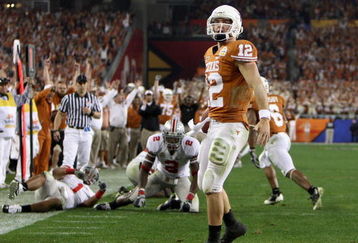 GLENDALE, AZ - JANUARY 05:  Quarterback Colt McCoy #12 of the Texas Longhorns scores on a 14 yard touchdown rush against the Ohio State Buckeyes during the third quarter of the Tostitos Fiesta Bowl Game on January 5, 2009 at University of Phoenix Stadium in Glendale, Arizona.  (Photo by Jed Jacobsohn/Getty Images)