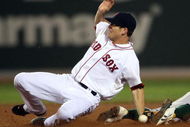 BOSTON - JULY 28:  Rajai Davis #11 of the Oakland Athletics steals second base in the 11th inning as Nick Green #22 of the Boston Red Sox fails to make the tag at Fenway Park July 28, 2009 in Boston, Massachusetts. The A's defeated the Boston Red Sox 9-8 in 11 innings. (Photo by Elsa/Getty Images)