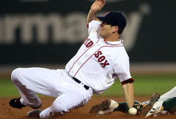 BOSTON - JULY 28:  Rajai Davis #11 of the Oakland Athletics steals second base in the 11th inning as Nick Green #22 of the Boston Red Sox fails to make the tag at Fenway Park July 28, 2009 in Boston, Massachusetts. The A's defeated the Boston Red Sox 9-8 in 11 innings. (Photo by Elsa/Getty Images)